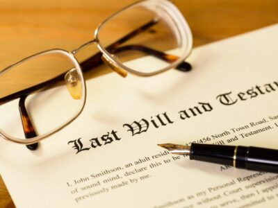 Couple meeting with a lawyer for wills to draft estate planning documents