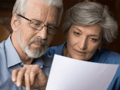Couple reviewing power of attorney documents together